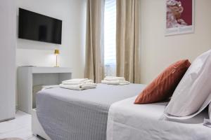 Ένα ή περισσότερα κρεβάτια σε δωμάτιο στο Lilì Apartments