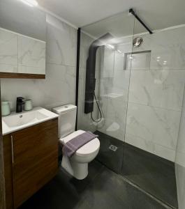 a bathroom with a shower and a toilet and a sink at Ηarmony 2 apartment next to the Acropolis museum in Athens +32 photos