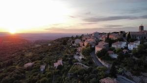 an aerial view of a town on a hill at sunset at Studio 2 pers Haut Var in Saint-Julien