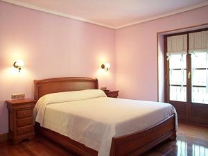 Postel nebo postele na pokoji v ubytování Hostal Rural Onbordi