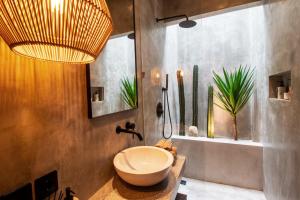 a bathroom with a toilet and a sink at Balenji Villa by BaliSuperHost in Munggu