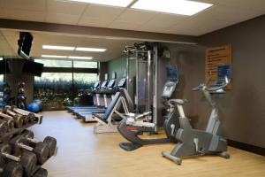 a gym with several treadmills and exercise bikes at Marriott Raleigh Durham Research Triangle Park in Durham
