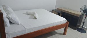 En eller flere senge i et værelse på Palm breeze villa