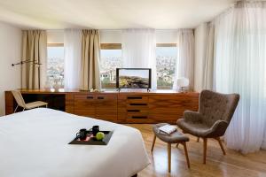 a hotel room with a bed and a chair at Miapera Hotel & Spa - Special Class in Istanbul