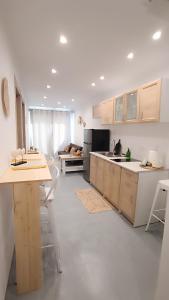 a kitchen with a table and chairs and a counter at Kanala Sea View in Kanala