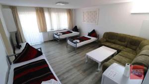 a living room with a couch and a table at Aparthotel Kompass A 201 in Essen
