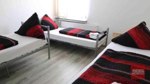 a room with two beds and a window at Aparthotel Kompass A 201 in Essen