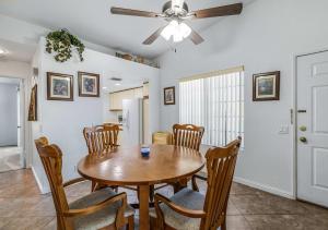a dining room with a table and chairs at Stylish Condo with Private Pool & & Panoramic View in Palm Springs