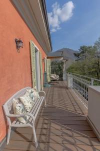 a porch with a bench on a house at Green Terrace in Cernobbio center in Cernobbio