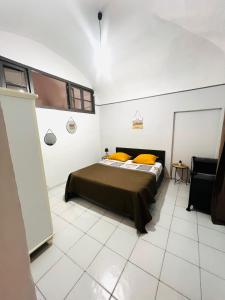 Ένα ή περισσότερα κρεβάτια σε δωμάτιο στο Joli T3 dans le centre de Bastia