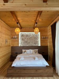 a bedroom with a bed in a wooden room at RİZE SERENİTY BUNGALOV in Rize +82 photos