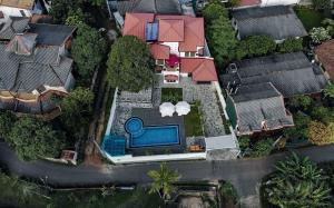an aerial view of a house with a swimming pool at Travel Cage in Hikkaduwa