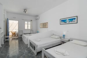Postel nebo postele na pokoji v ubytování Apollon Rooms