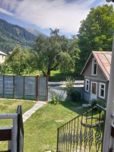 a view from the balcony of a house with a fence at Guesthouse ''Kavkasioni'' in Glola
