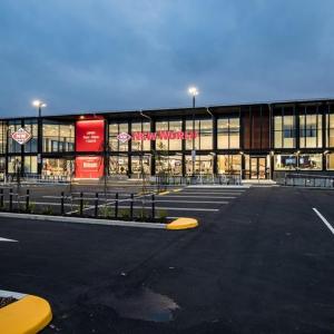 an empty parking lot in front of a building at Cosy CBD 1 Bedroom Apartment in Christchurch