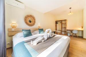 Hotel Exsel Floralys客房内的一张或多张床位