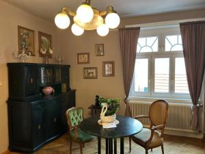 a living room with a table and chairs at Weinvilla in Wolkersdorf