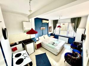 a small room with a bed and a table at Taksim Amur Mansion Hotel in Istanbul