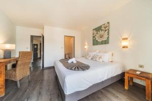 Postel nebo postele na pokoji v ubytování Hôtel Exsel Ermitage