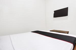 Μια τηλεόραση ή/και κέντρο ψυχαγωγίας στο Hotel O Oteng Stay +53 φωτογραφίες