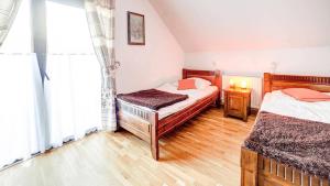 Ένα ή περισσότερα κρεβάτια σε δωμάτιο στο Solny - Resort w Bieszczadach