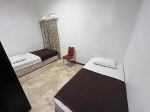 Postel nebo postele na pokoji v ubytování Hotel O Bungalow Homestay