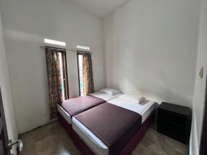 Postel nebo postele na pokoji v ubytování Hotel O Bungalow Homestay