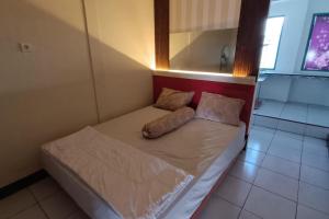 Postel nebo postele na pokoji v ubytování OYO 94700 Kd House