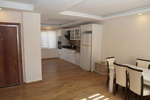 a kitchen and dining room with a table and chairs at BlueHomes Villas in Belek