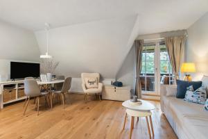 TV a/nebo společenská místnost v ubytování Ferienwohnung Hygge an der Nordsee