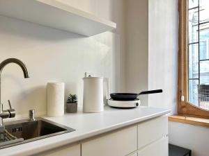 a kitchen with a sink and a counter top at Dream in Tbilisi City +6 photos
