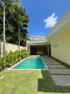 a swimming pool in the backyard of a house at COP30 house in gated community in Ananindeua