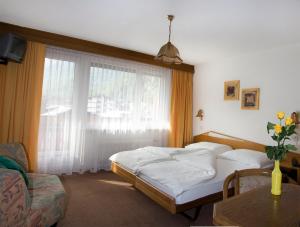 Postel nebo postele na pokoji v ubytování Hotel Alpha