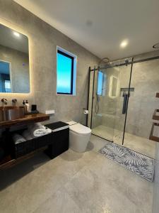 a bathroom with a sink toilet and a shower at Lake Hood Escape & Private Jetty in Ashburton