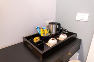 a black counter with a coffee maker on it at Montebello Comfort in Ancona