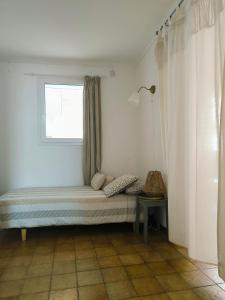 a bed in a room with a window at Auravignon in Sorgues +14 photos