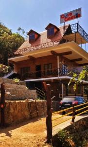 a building with a car parked in front of it at The Royal Summit, Panchalimedu in Suryanelli