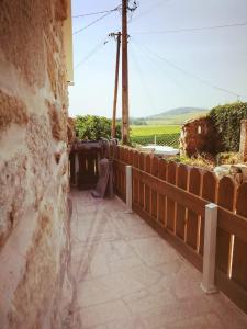 a balcony with a fence and a view of a field at CASAS DA RUA NOVA in Alijó +11 photos