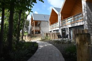 a house with a brick walkway in front of it at Pidder-Lyng Apartment 11 in Böhl