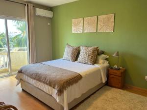 Postel nebo postele na pokoji v ubytování Apartment Tamarinier Complexe