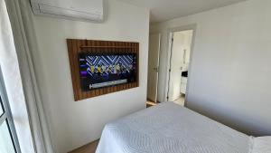 Posteľ alebo postele v izbe v ubytovaní Apartamento Novo e Completo no Centro com garagem