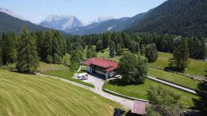 an aerial view of a house in the mountains at Panorama Quartier Seefeld in Seefeld in Tirol