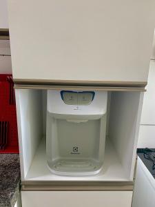an empty refrigerator with its door open in a kitchen at Apartamento Lótus Ar Cond Pertinho FIG e Centro in Garanhuns +24 photos