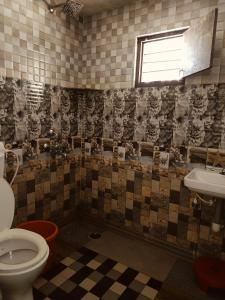 Koupelna v ubytování Joldal Cozy Camp Homestay & Resorts