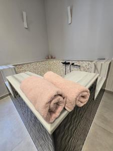 a bathroom with a sink with towels on it at Mare e Relax in Mola di Bari