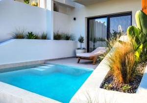 a swimming pool in the backyard of a house at Orizontas Suites in Syvota +66 photos