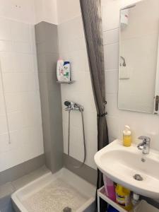 a bathroom with a shower and a sink at ALEKA KOTSI ROOMS in Igoumenitsa +26 photos