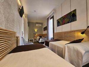 Postel nebo postele na pokoji v ubytování Hotel Palermo
