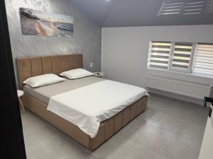 Postel nebo postele na pokoji v ubytování Sipotul Apelor