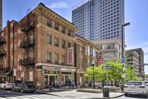 a building on the corner of a city street with buildings at Harbor furnished apartments free indoor parking in Baltimore
